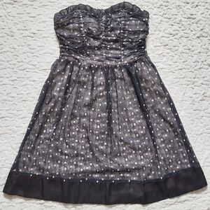 Strapless black and silver lace dress with ruffle and ribbon details